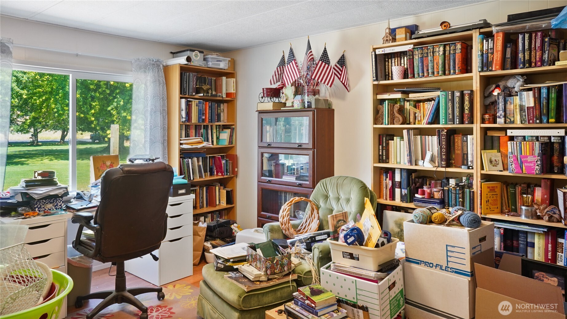 101 Mail Road Othello, WA 99344 - Photo 24 of 40 a room with furniture book shelf and a window