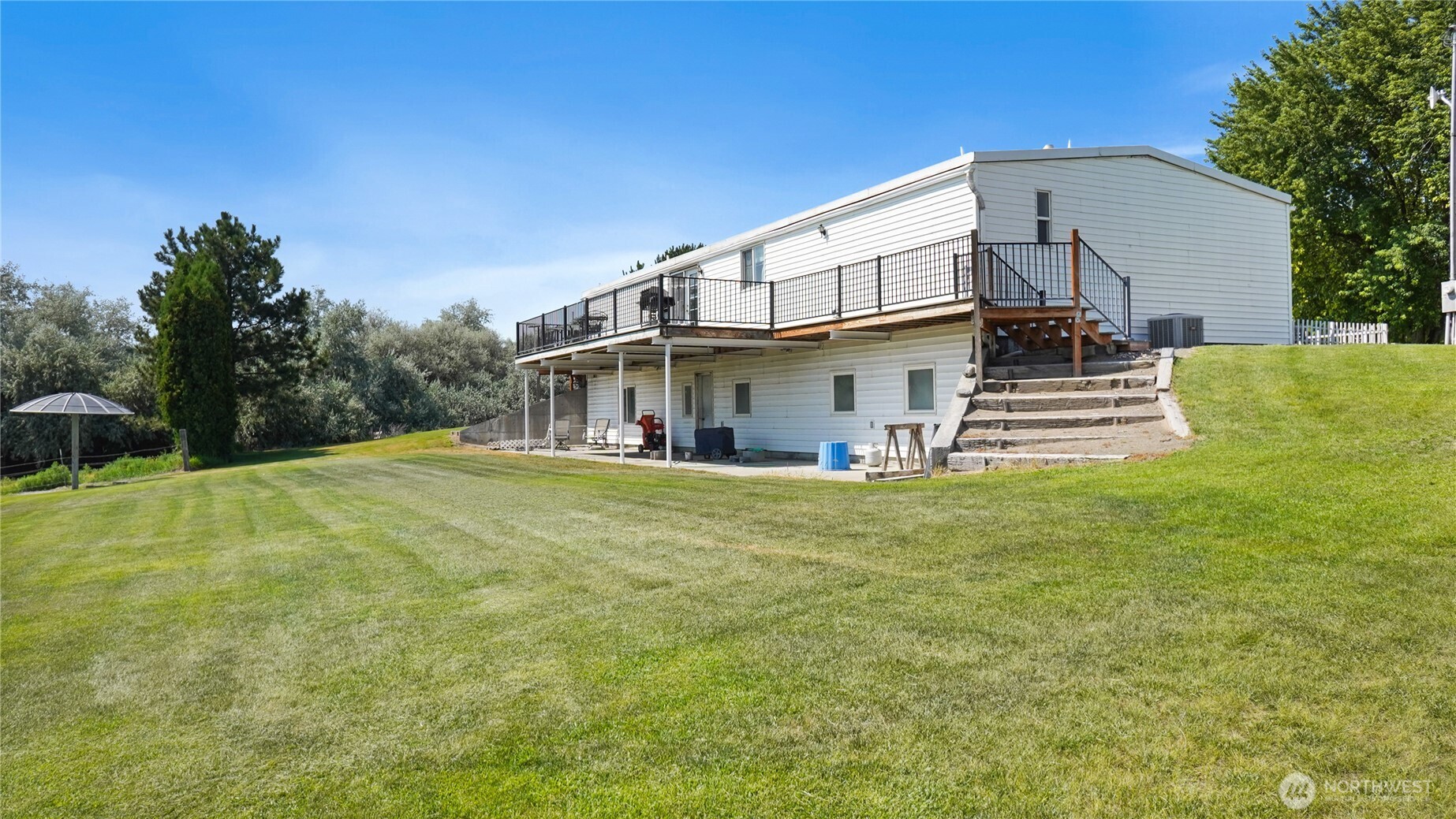 101 Mail Road Othello, WA 99344 - Photo 6 of 40 a view of a house with a yard