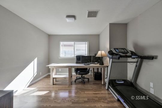 1113 Amie Court Ridgecrest, CA 93555 - Photo 18 of 33 a view of a workspace with furniture and a window