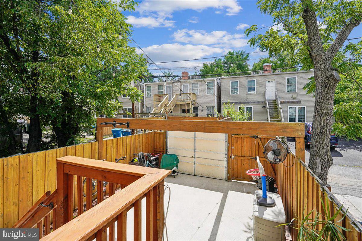 1203 Staples Street Northeast Washington, DC 20002 - Photo 15 of 51 Sunny outdoor retreat with wooden deck.