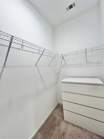 a view of a room with racks on the wall