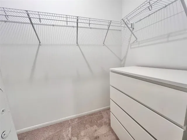a bathroom with a double vanity sink toilet mirror and bathtub