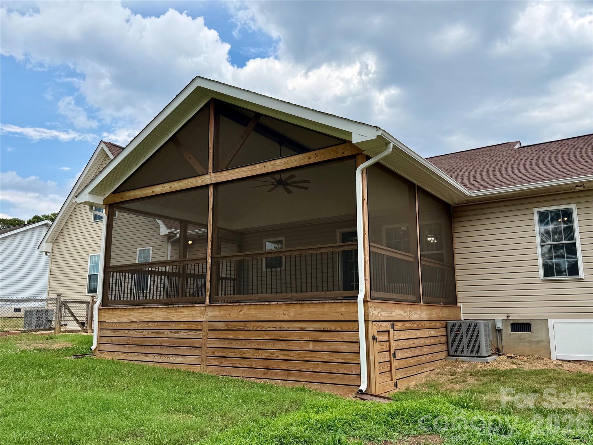 1027 Tabor Road Olin, NC 28660 - Photo 42 of 43 a view of wooden house with a small yard