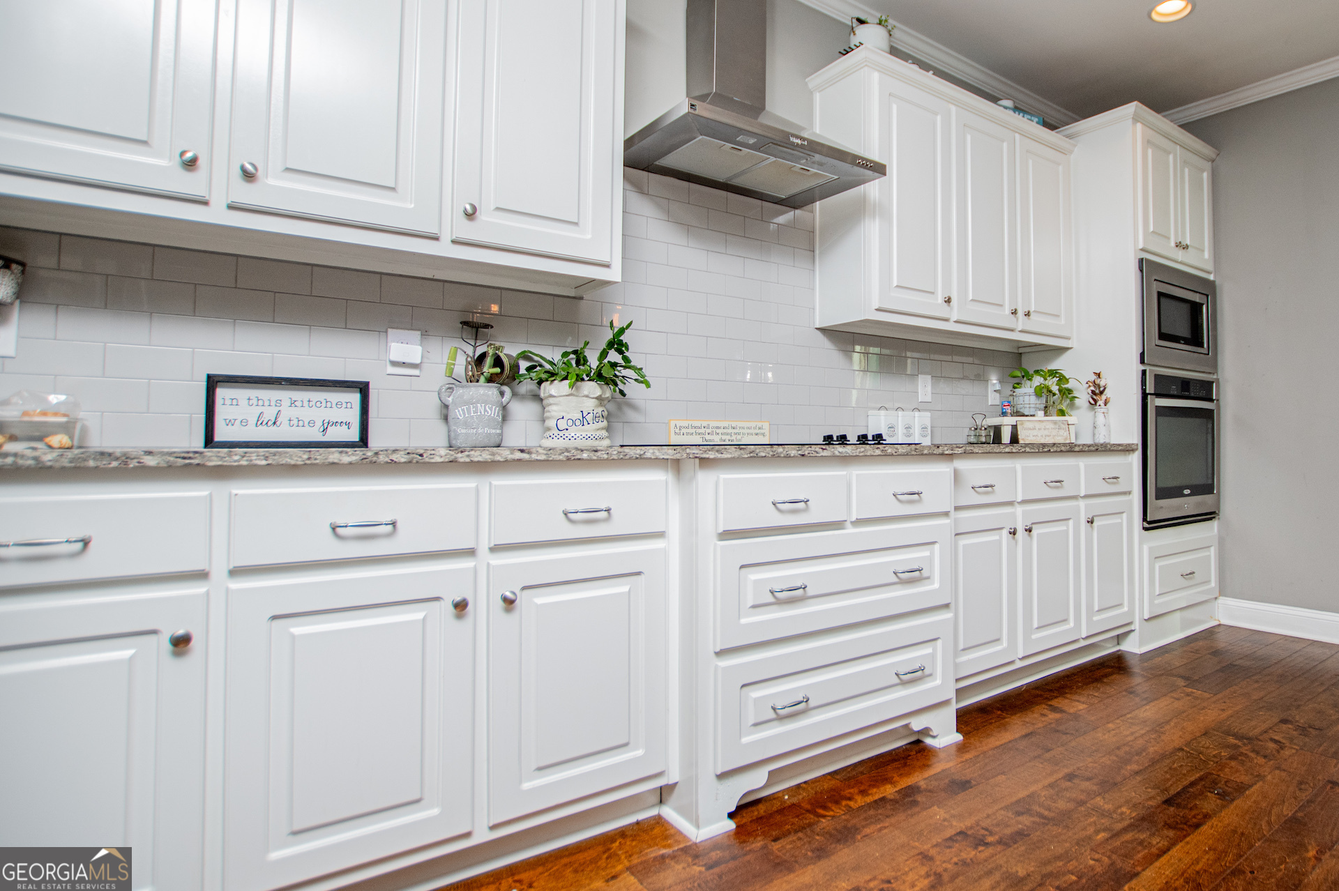 201 Overton Point Carrollton, GA 30116 - Photo 27 of 87 a kitchen with granite countertop white cabinets and stainless steel appliances