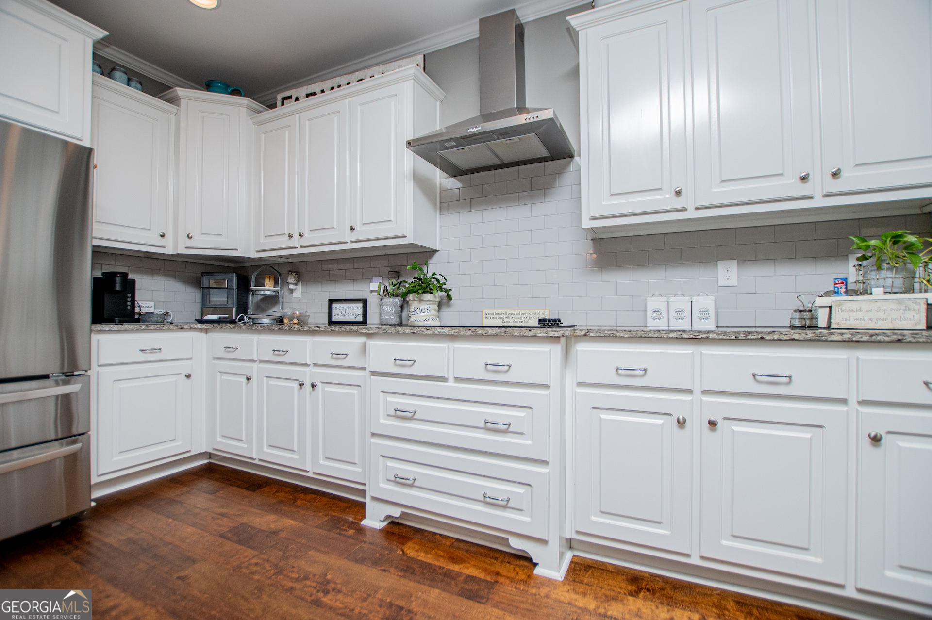 201 Overton Point Carrollton, GA 30116 - Photo 28 of 87 a kitchen with granite countertop white cabinets and stainless steel appliances