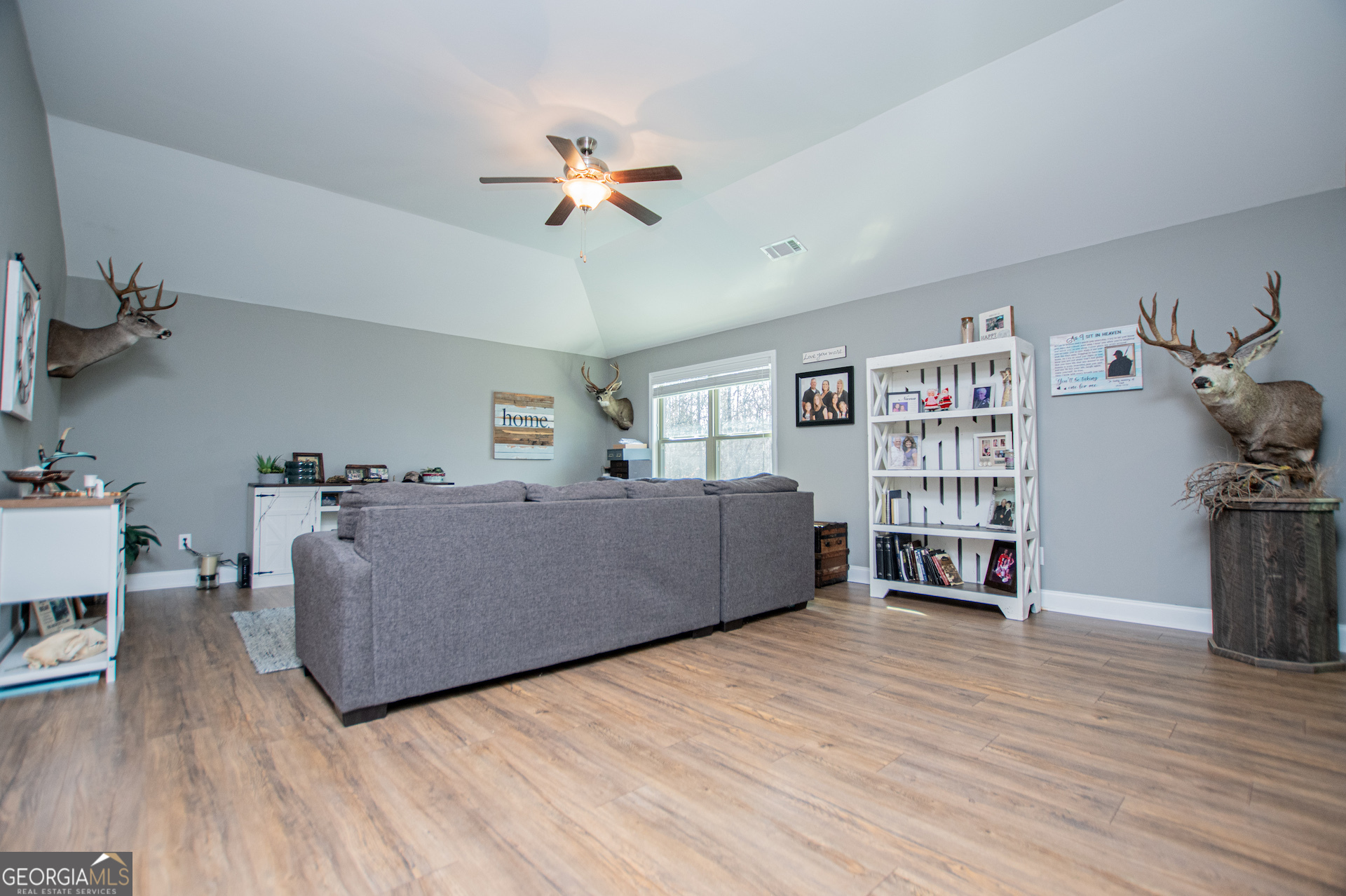 201 Overton Point Carrollton, GA 30116 - Photo 41 of 87 a living room with furniture and a wooden floor