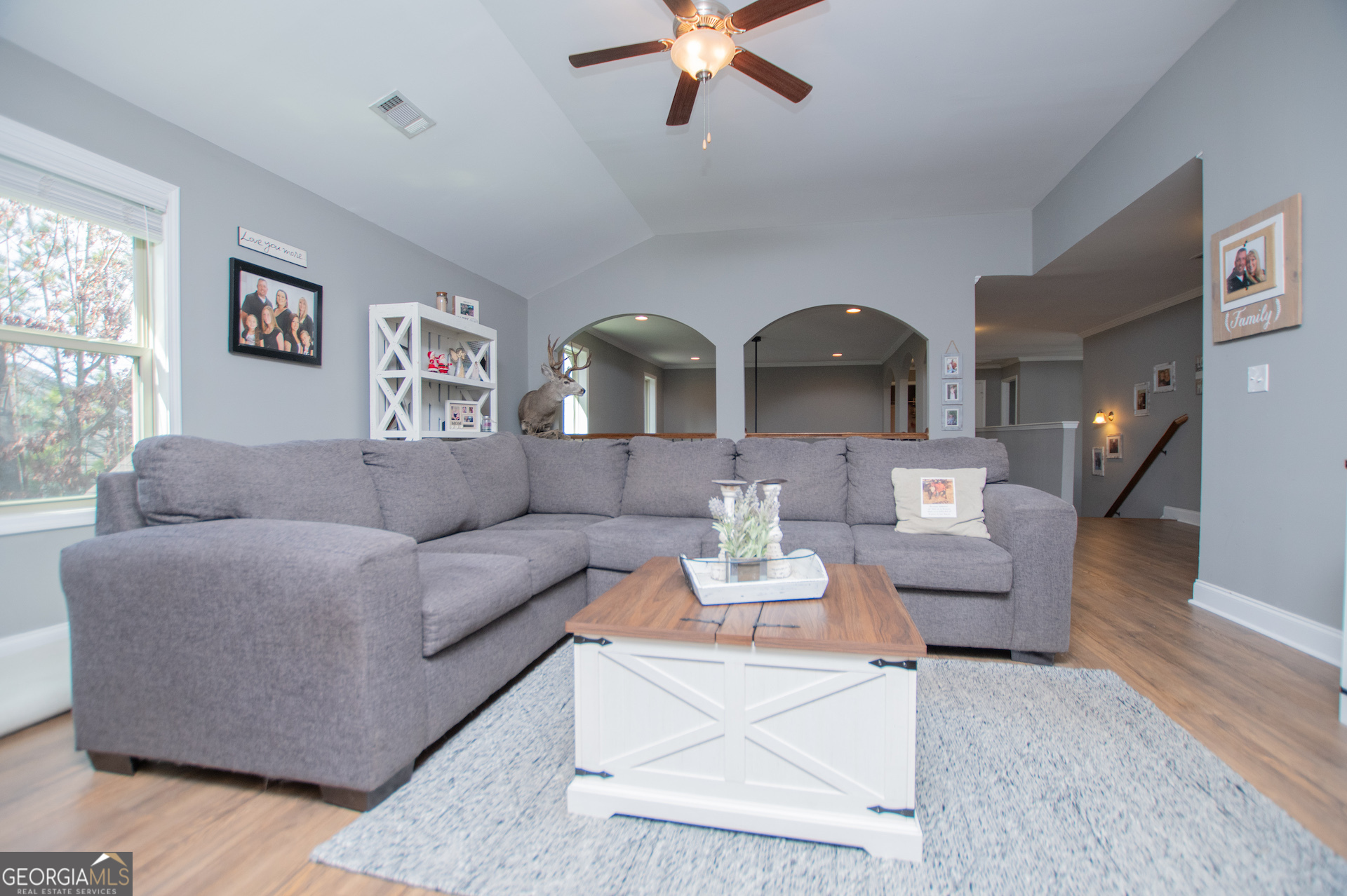 201 Overton Point Carrollton, GA 30116 - Photo 44 of 87 a living room with furniture and a wooden floor