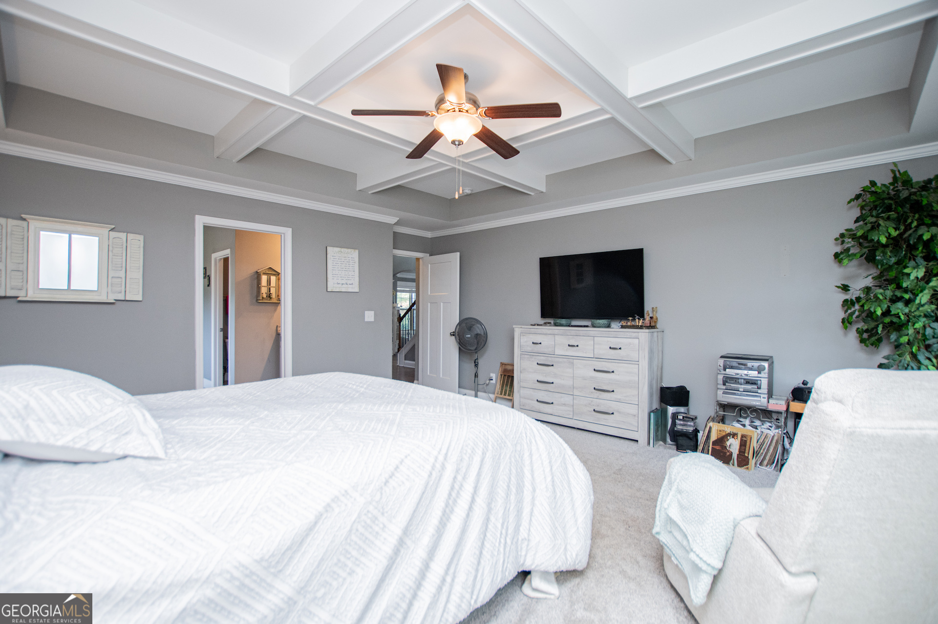 201 Overton Point Carrollton, GA 30116 - Photo 47 of 87 a bedroom with a bed a flat screen tv and a couch