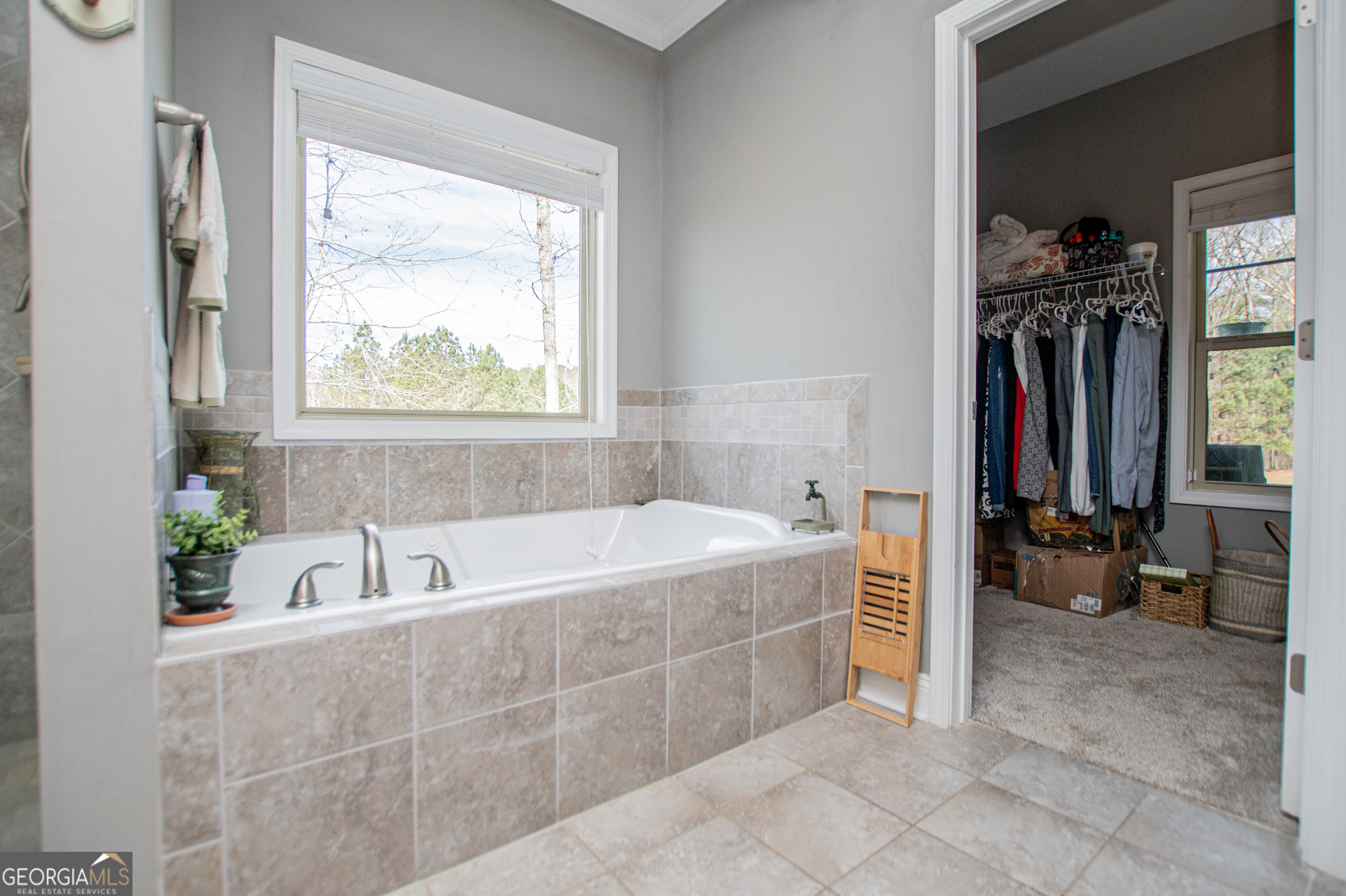 201 Overton Point Carrollton, GA 30116 - Photo 50 of 87 a bathroom with a tub a sink and a window