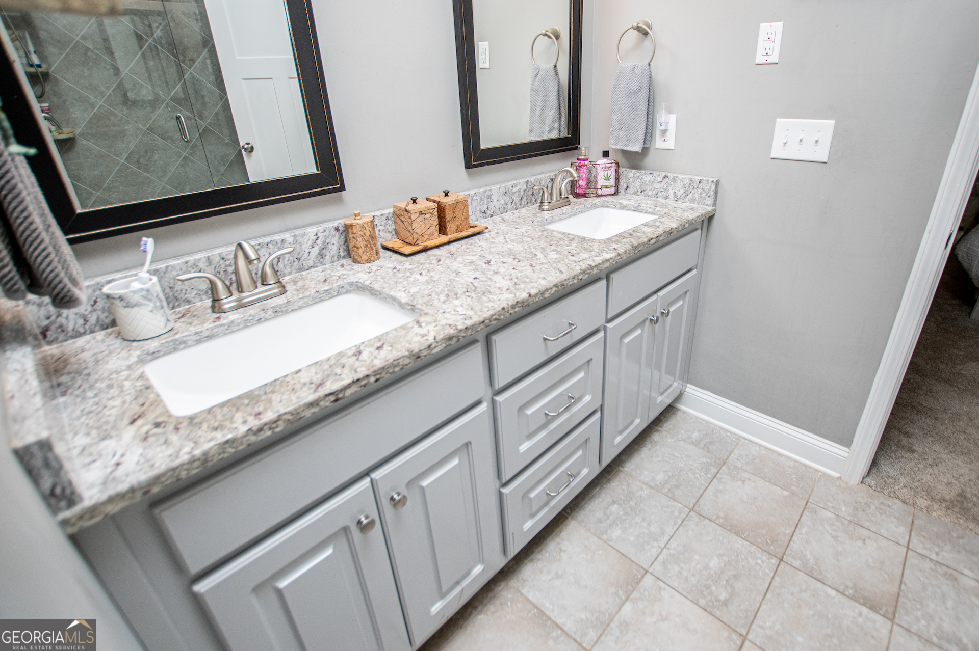 201 Overton Point Carrollton, GA 30116 - Photo 52 of 87 a bathroom with a granite countertop sink and a mirror