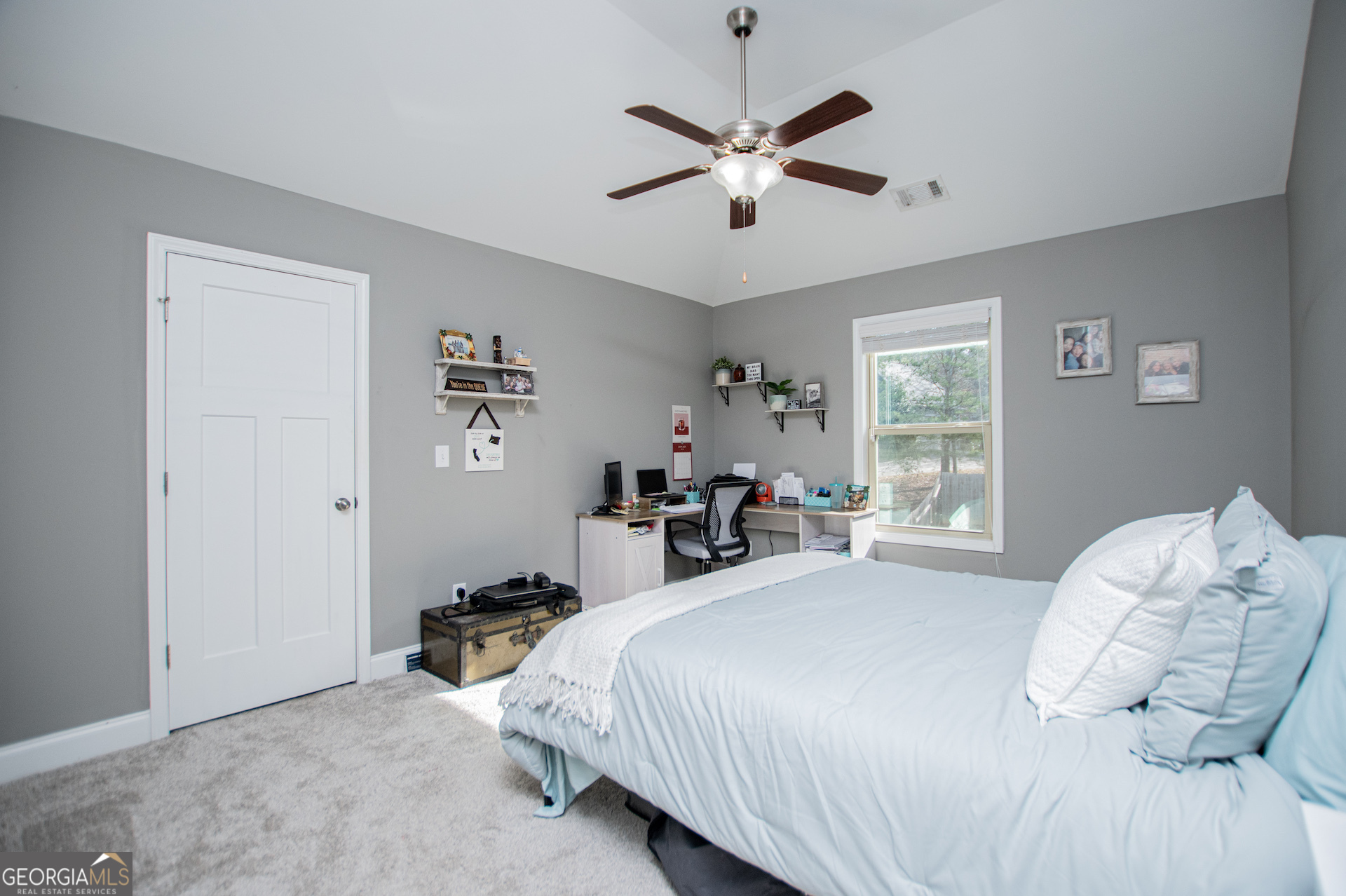 201 Overton Point Carrollton, GA 30116 - Photo 57 of 87 a bed room with a bed and a chandelier