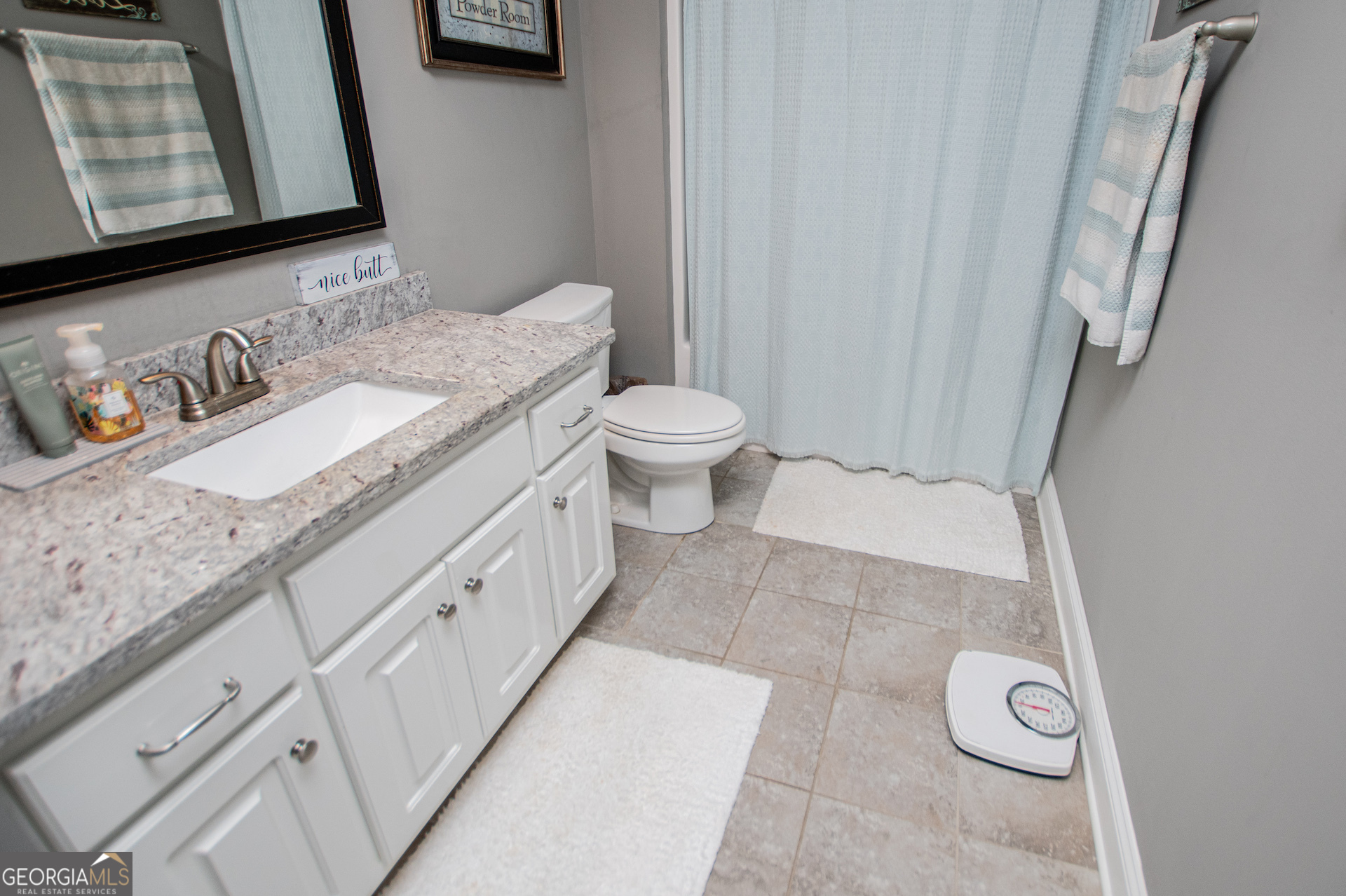 201 Overton Point Carrollton, GA 30116 - Photo 60 of 87 a bathroom with a granite countertop sink and a mirror