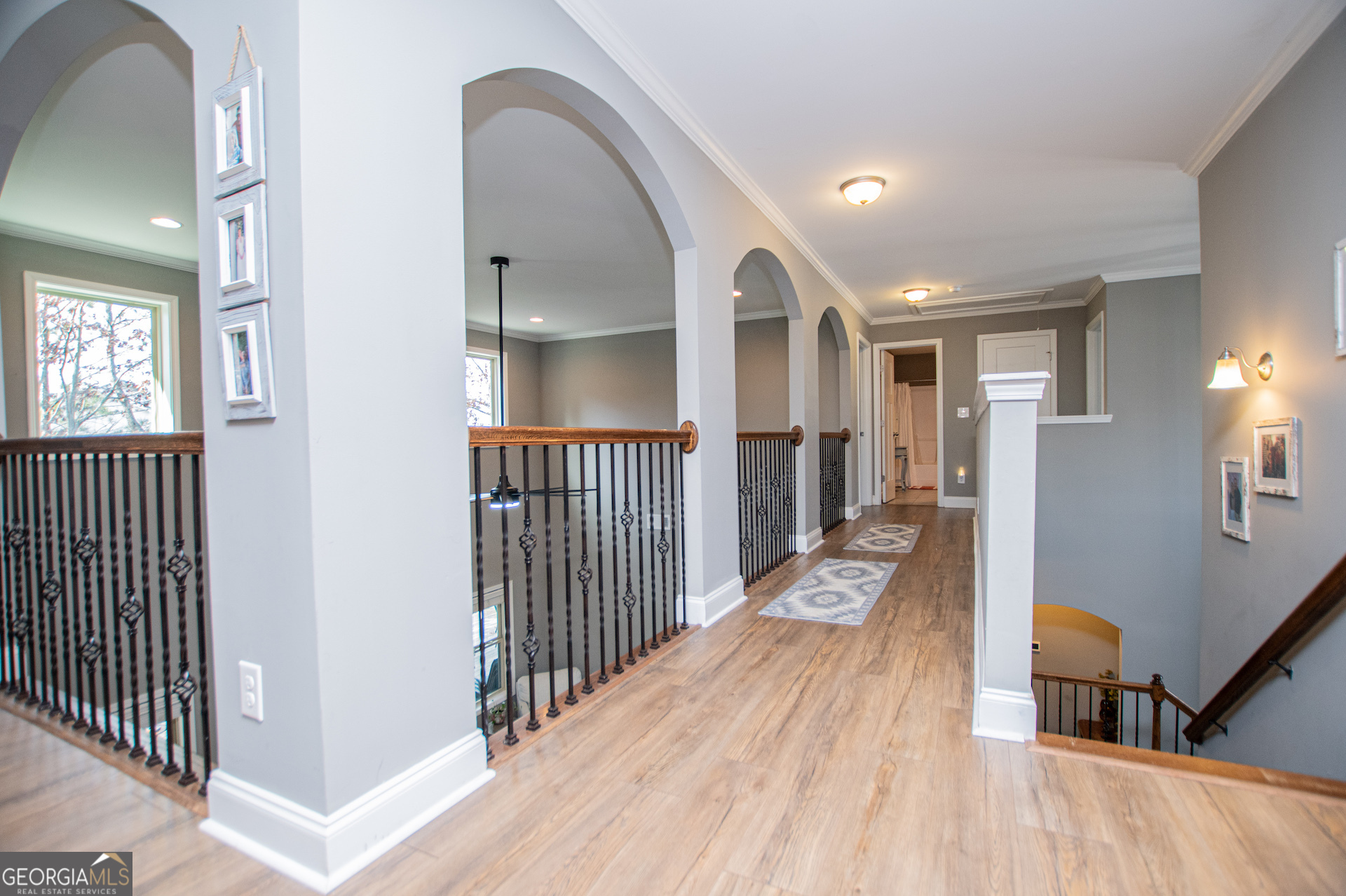 201 Overton Point Carrollton, GA 30116 - Photo 62 of 87 a view of a hallway view with wooden floor and staircase