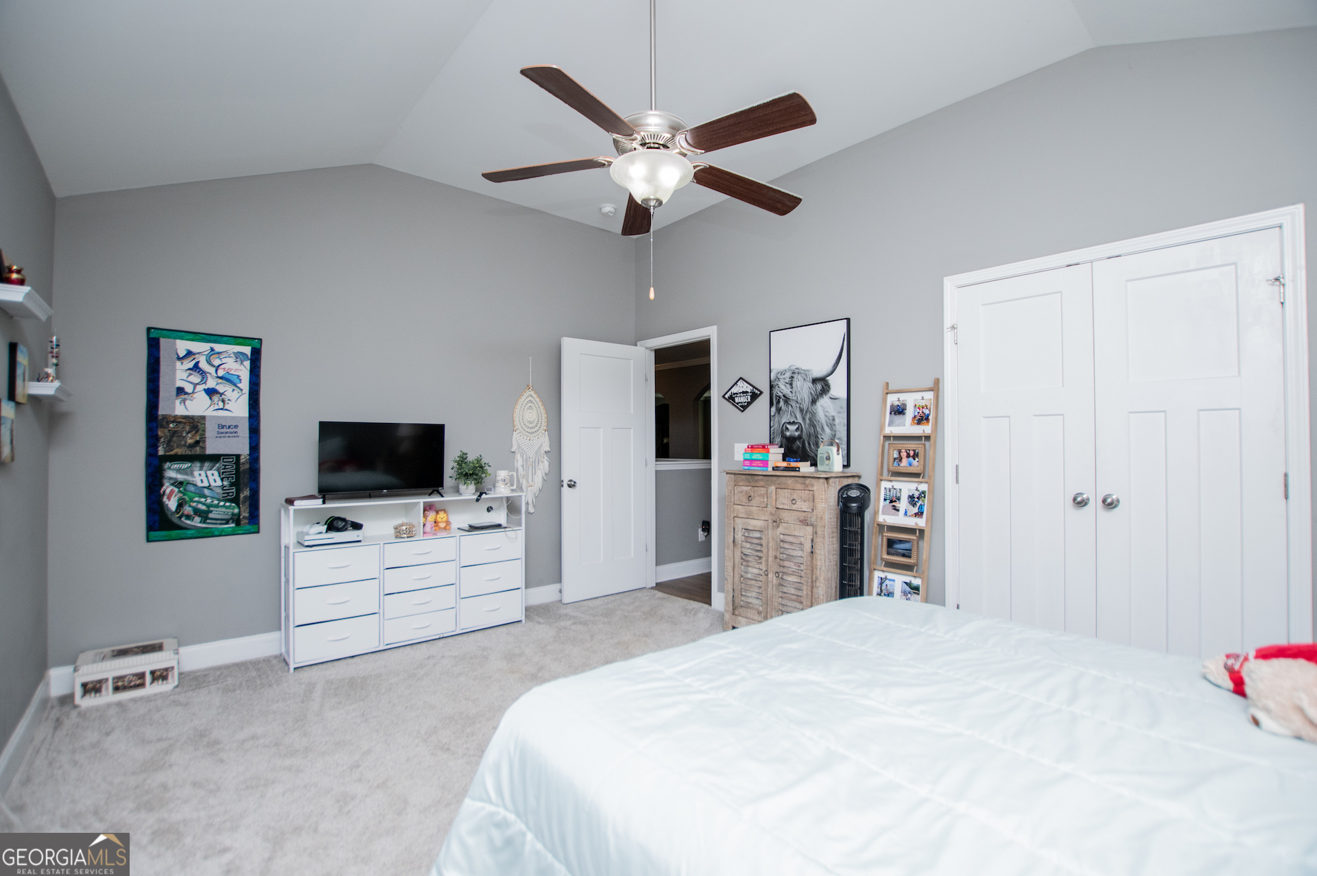 201 Overton Point Carrollton, GA 30116 - Photo 64 of 87 a bedroom with a bed and a flat screen tv