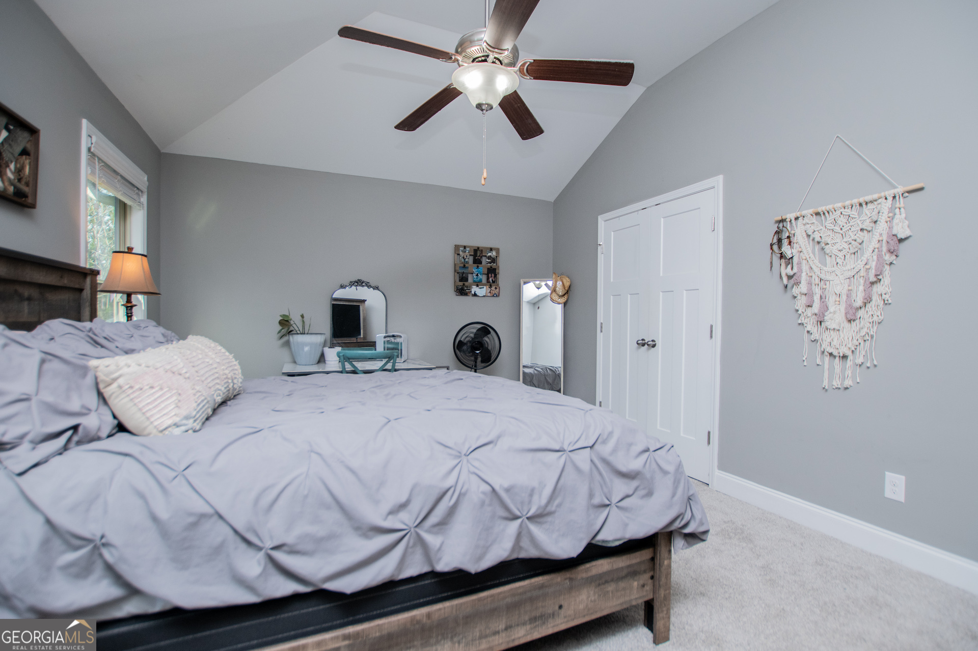 201 Overton Point Carrollton, GA 30116 - Photo 69 of 87 a bedroom with a bed and a chandelier