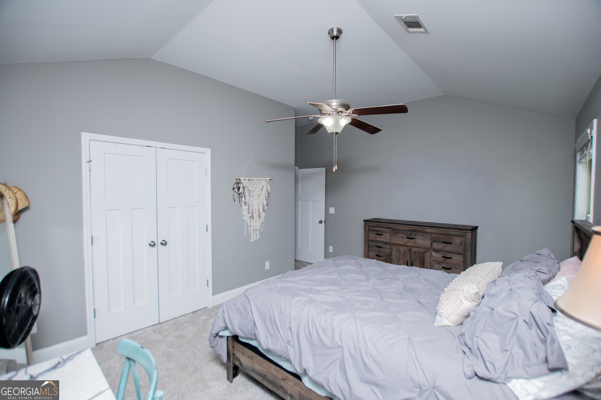 201 Overton Point Carrollton, GA 30116 - Photo 70 of 87 a bedroom with a bed and a chandelier