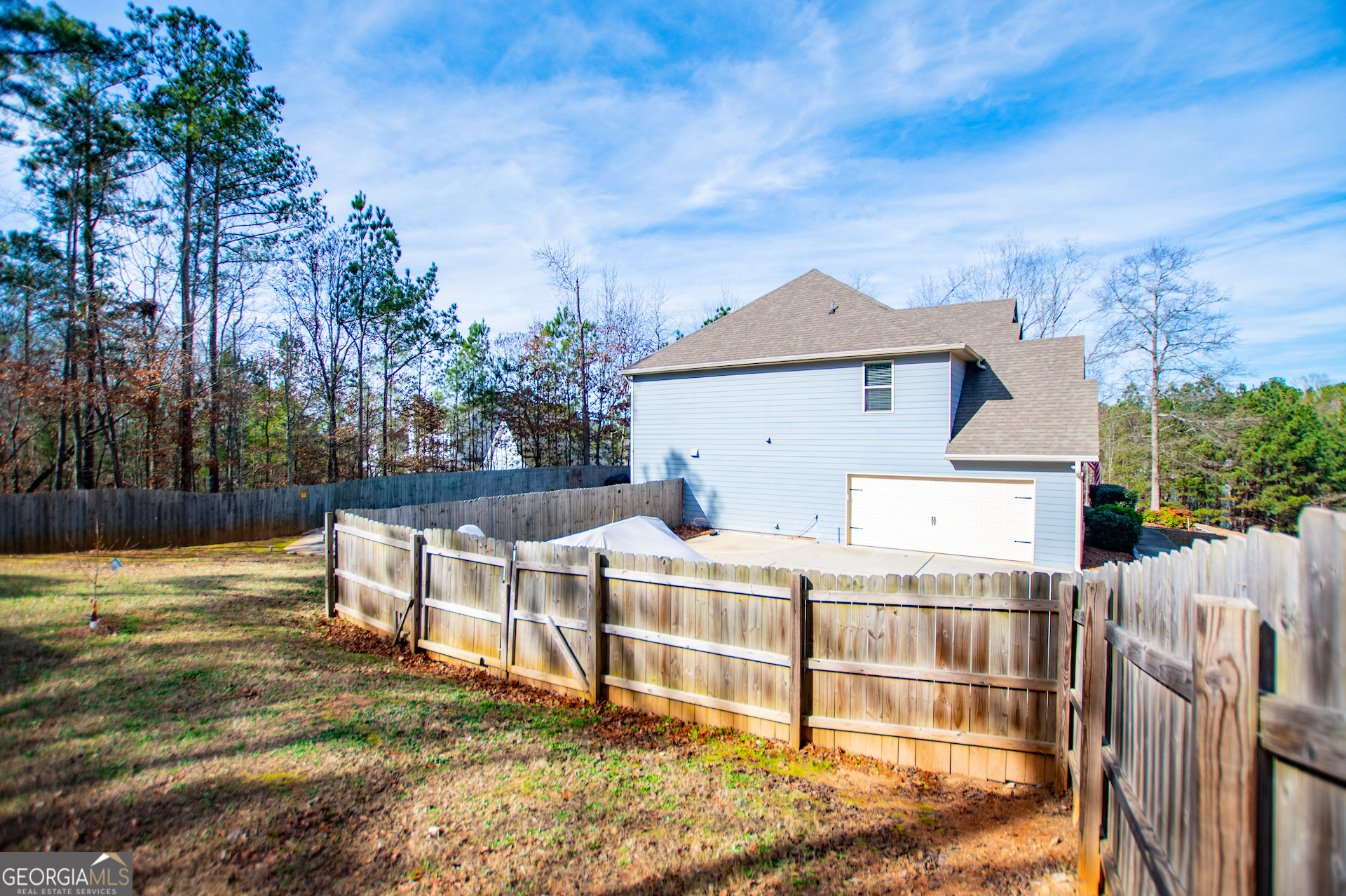 201 Overton Point Carrollton, GA 30116 - Photo 84 of 87 a view of a house with wooden deck and a yard