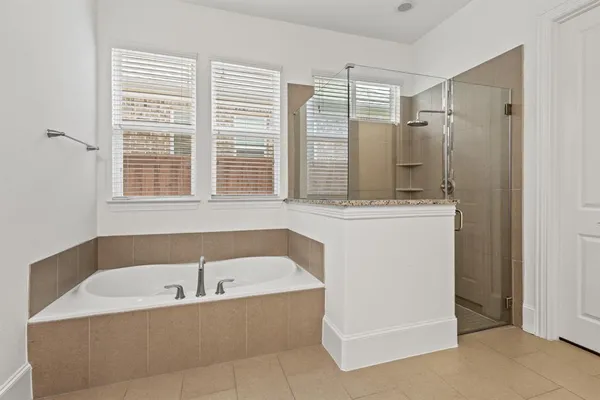 a bathroom with a bathtub and a sink