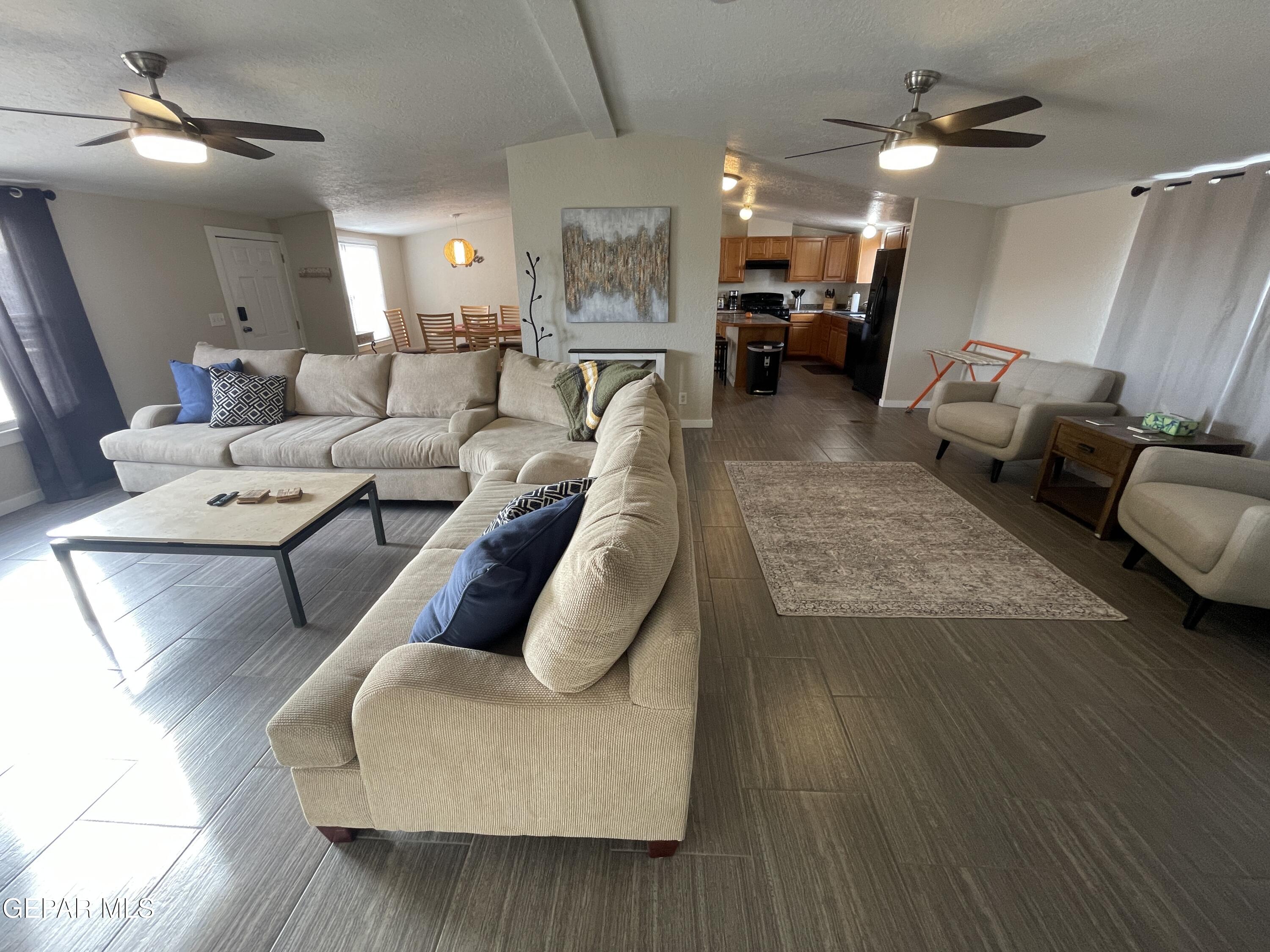 2901 Cook Street Truth Or Consequences, NM 87901 - Photo 3 of 28 a living room with furniture and a chandelier