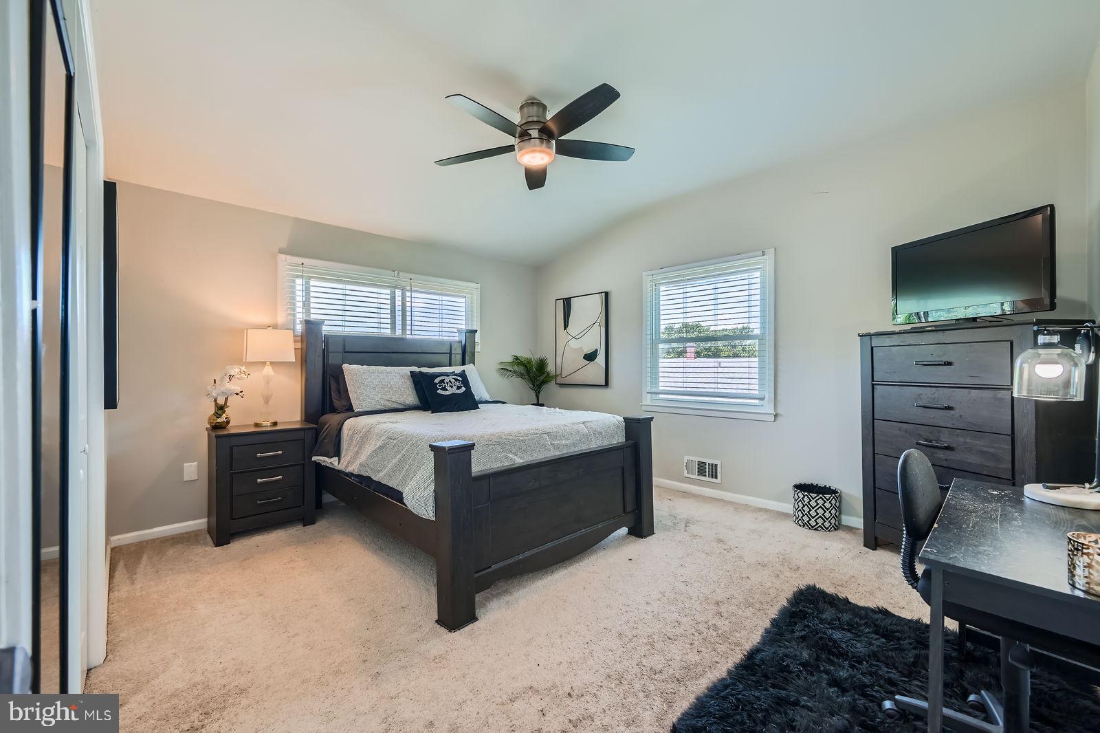 1201 Cobb Road Baltimore, MD 21208 - Photo 15 of 28 a bedroom with a bed and a flat screen tv