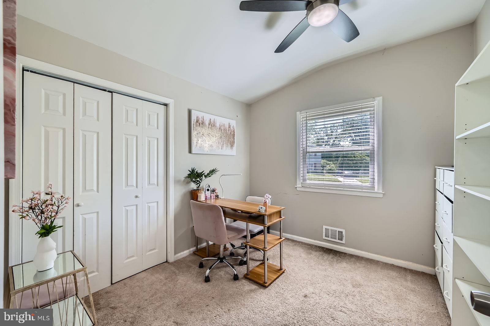 1201 Cobb Road Baltimore, MD 21208 - Photo 17 of 28 a view of a workspace with furniture and a window
