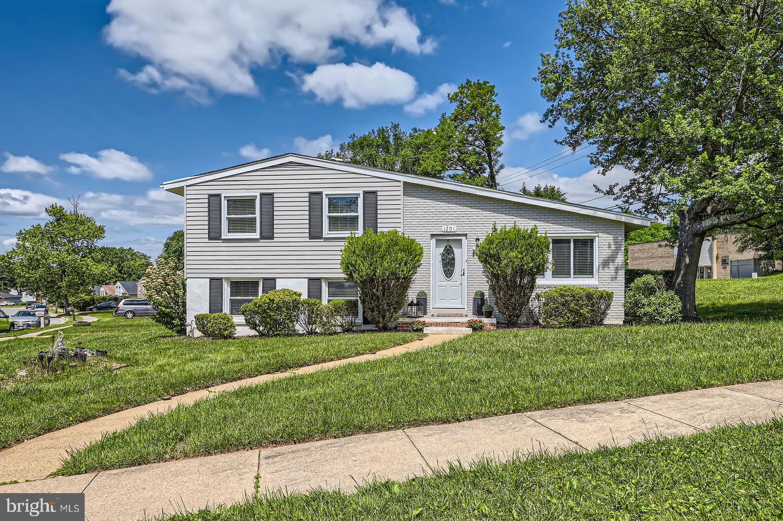 1201 Cobb Road Baltimore, MD 21208 - Photo 2 of 28 a front view of a house with a yard