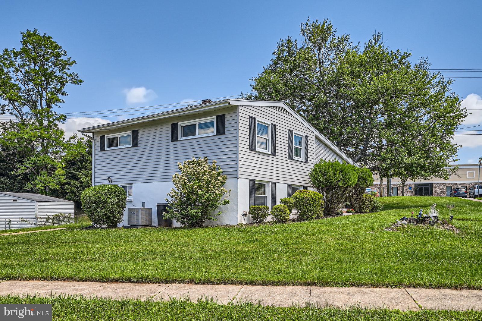 1201 Cobb Road Baltimore, MD 21208 - Photo 27 of 28 a front view of a house with a garden