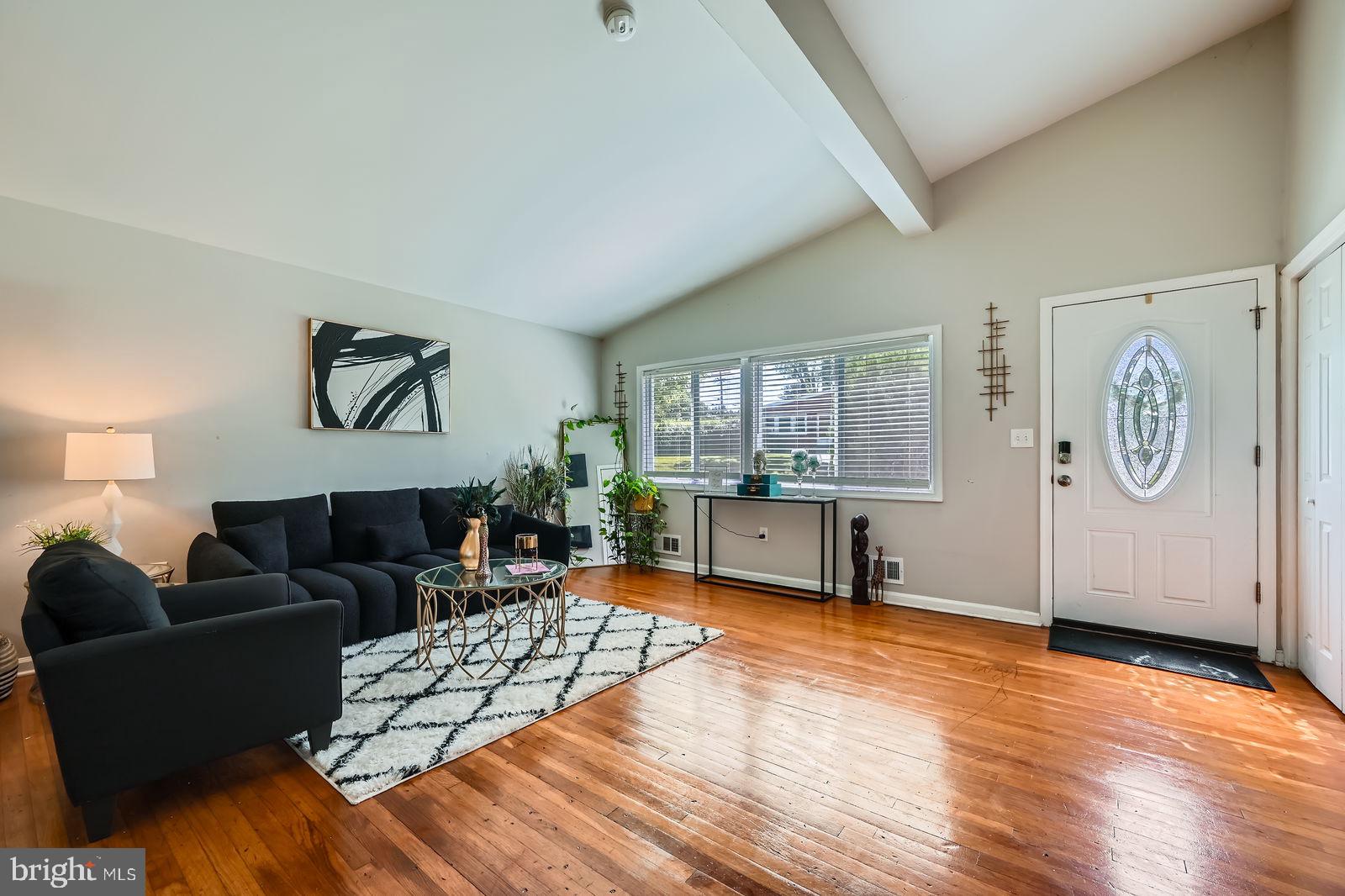 1201 Cobb Road Baltimore, MD 21208 - Photo 5 of 28 a living room with furniture and wooden floor