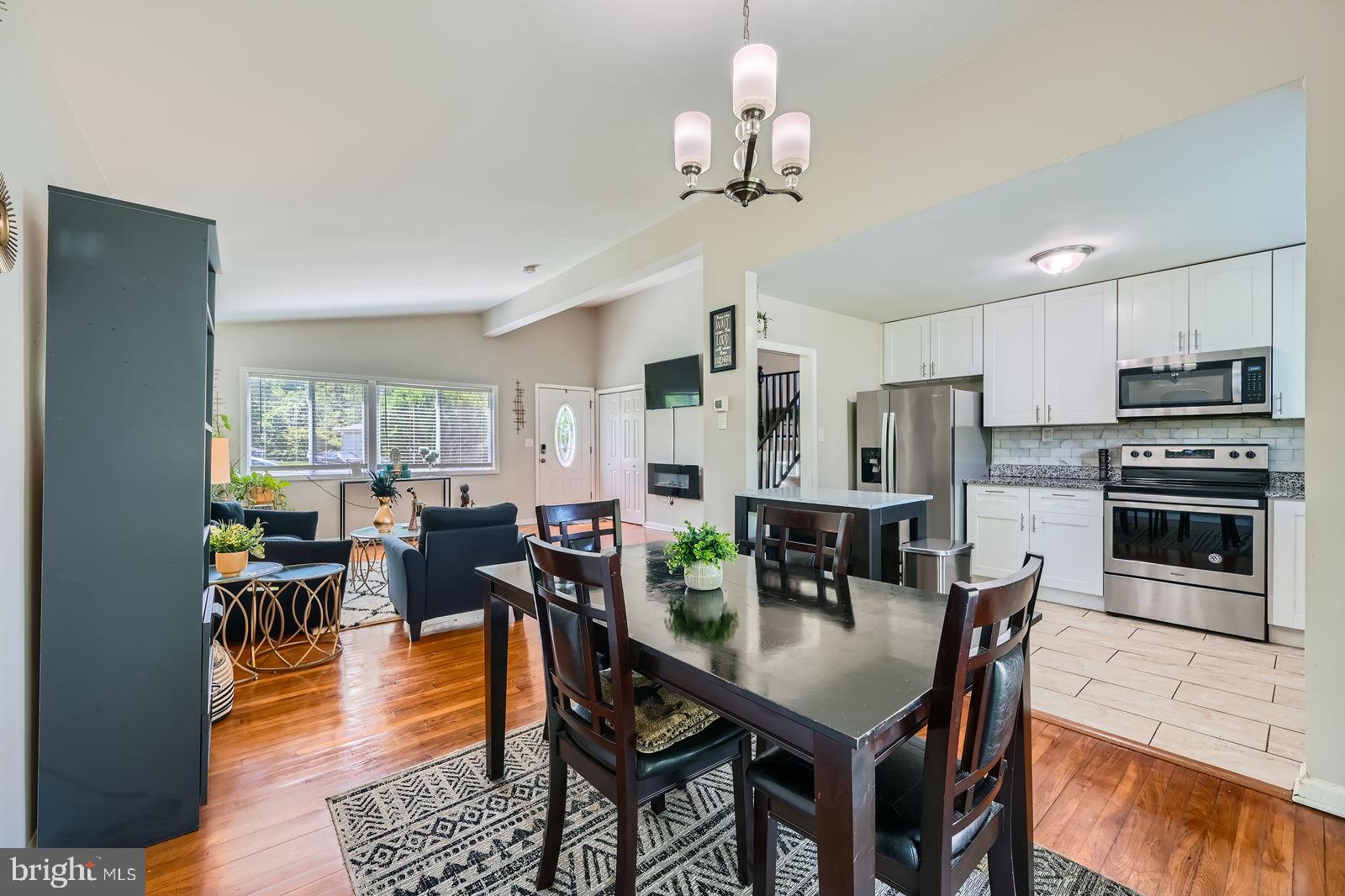 1201 Cobb Road Baltimore, MD 21208 - Photo 8 of 28 a view of a dining room with furniture window and wooden floor
