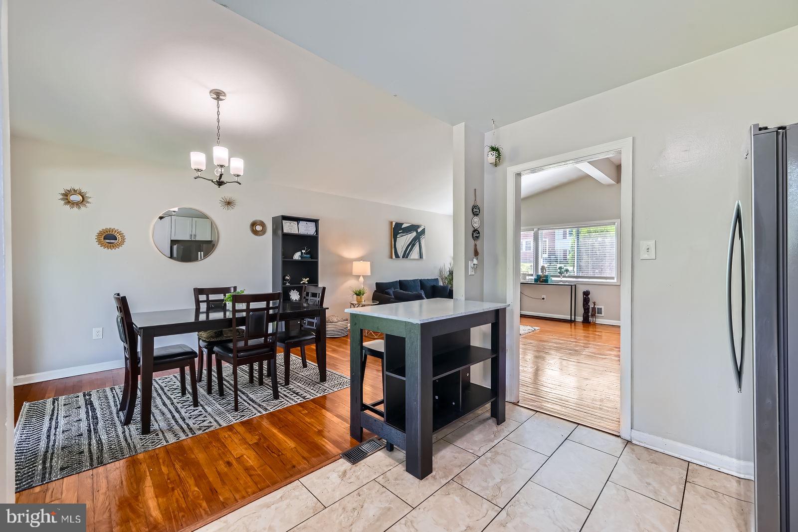 1201 Cobb Road Baltimore, MD 21208 - Photo 10 of 28 a view of a dining room with furniture window and wooden floor