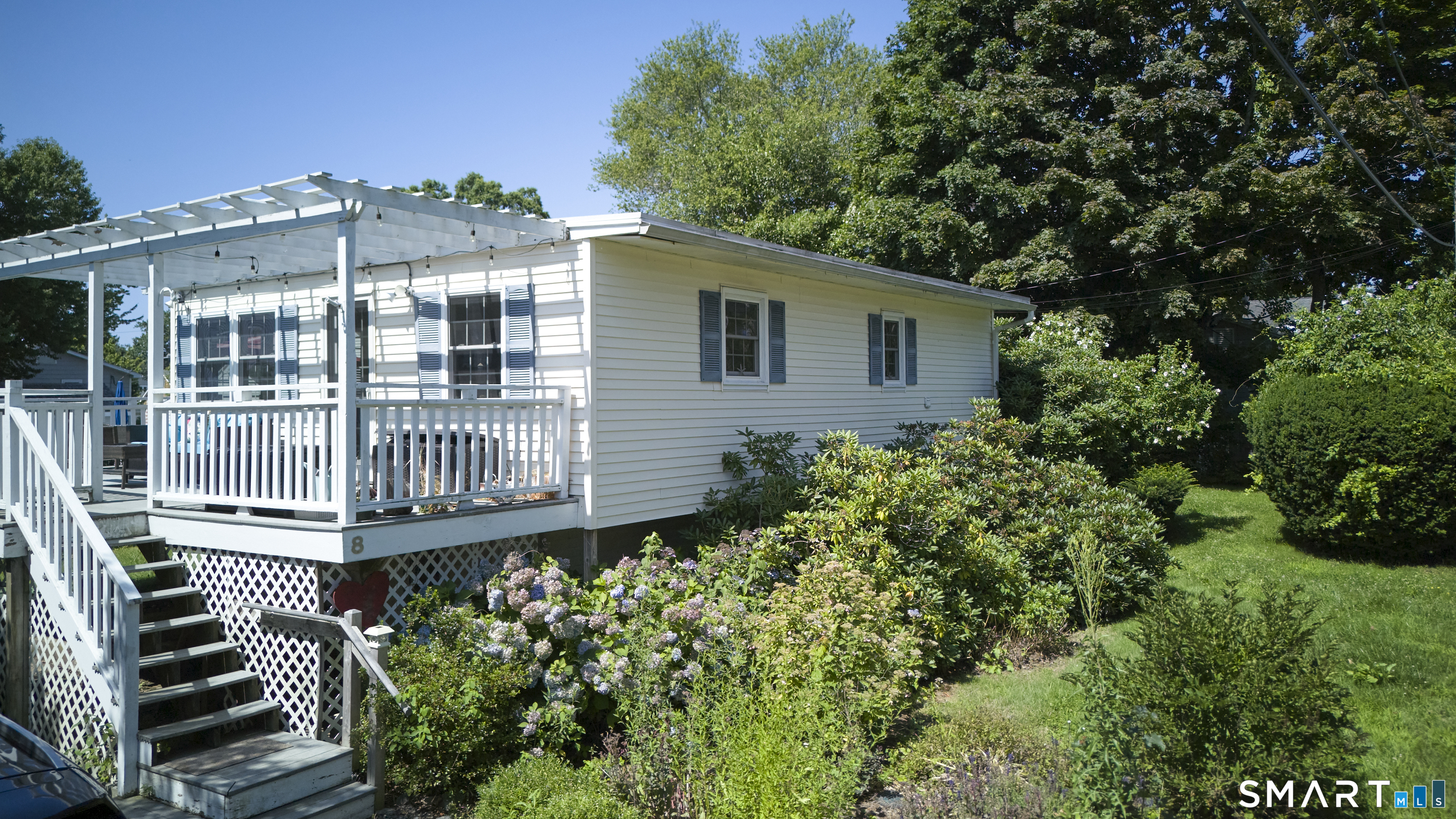 8 Kenn Road Old Saybrook, CT 06475 - Photo 4 of 40 Sunny outdoor living surrounded by mature landscaping.
