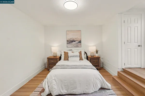 a bed room with a bed and a lamp