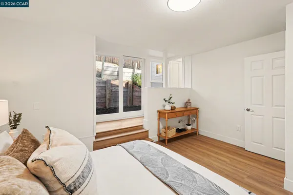 a bedroom with furniture and a window