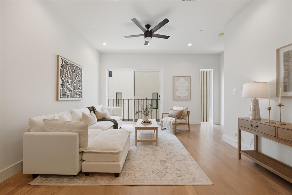 4517 Munger Avenue, Unit 101 Dallas, TX 75204 - Photo 25 of 39 a living room with furniture and wooden floor