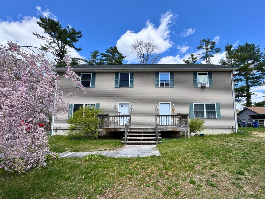 3 Davids Way, Unit A Wareham, MA 02576 - Photo 1 of 18 a front view of a house with garden