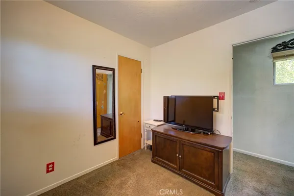a living room with furniture and flat screen tv