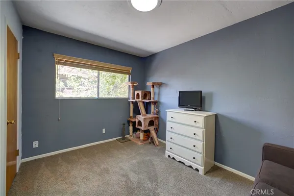wooden room with furniture and window
