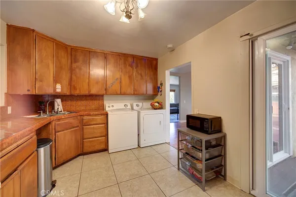 a kitchen with a cabinets and appliances