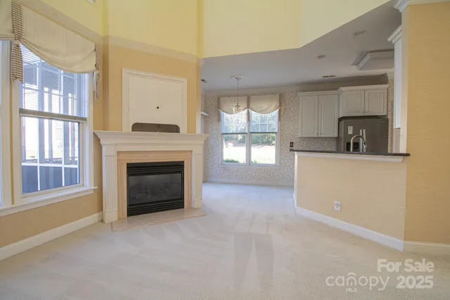 a kitchen with stainless steel appliances granite countertop white cabinets and a sink
