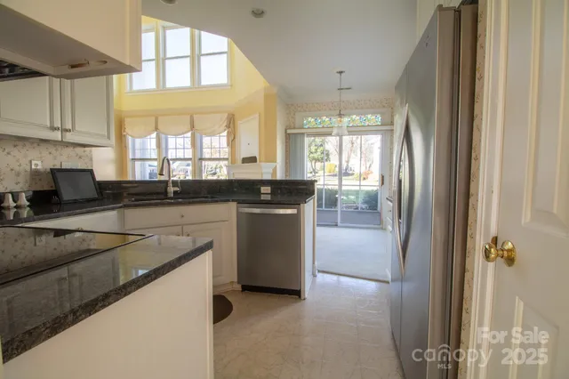 a view of a kitchen with electric appliances