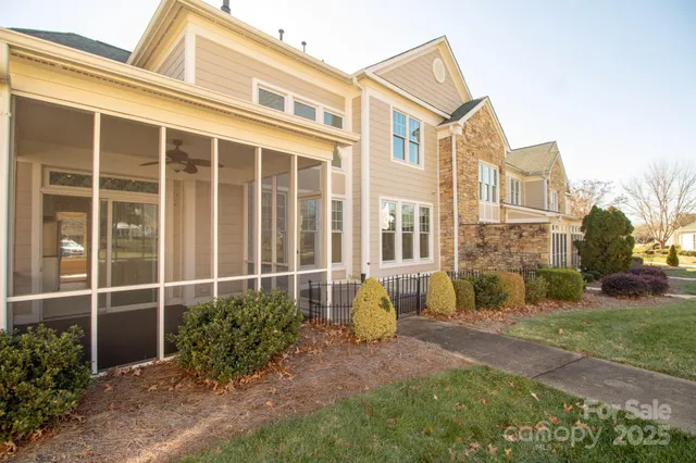 a view of a room with windows and balcony