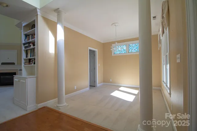 a view of an entryway with a bookshelf