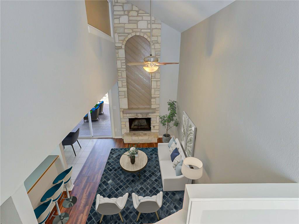 1710 Cinnamon Path, Unit B Austin, TX 78704 - Photo 1 of 1 Dramatic floor to ceiling Texas limestone fireplace - *pic digitally staged*