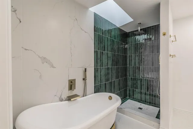 a bathroom with a toilet and shower