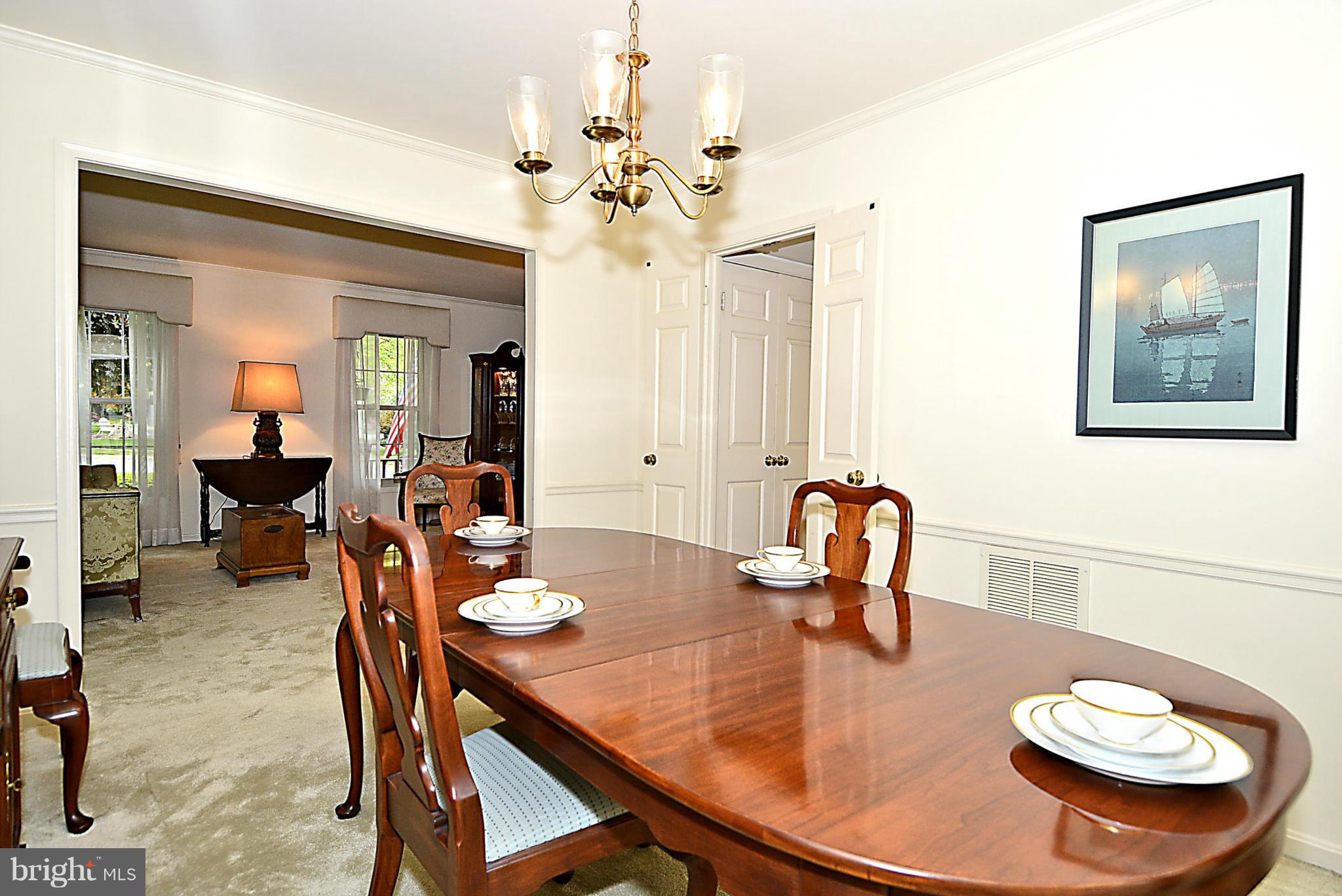 9213 Wyeth Lane Burke, VA 22015 - Photo 9 of 28 a dining room with furniture and wooden floor
