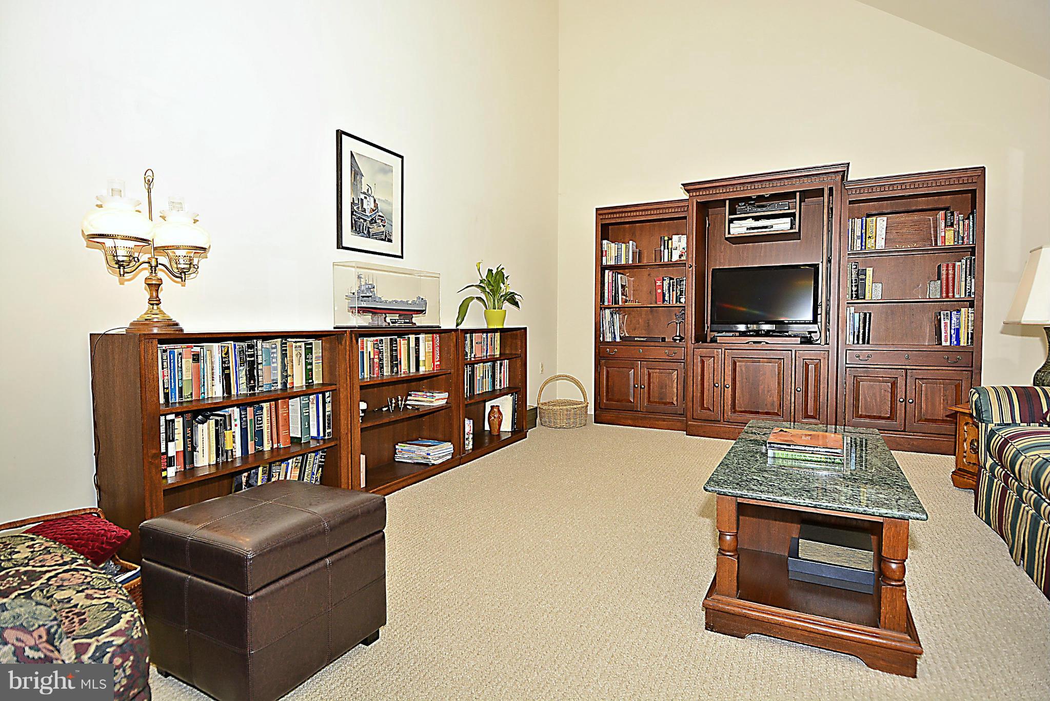 9213 Wyeth Lane Burke, VA 22015 - Photo 10 of 28 a living room with furniture fireplace and wooden floor