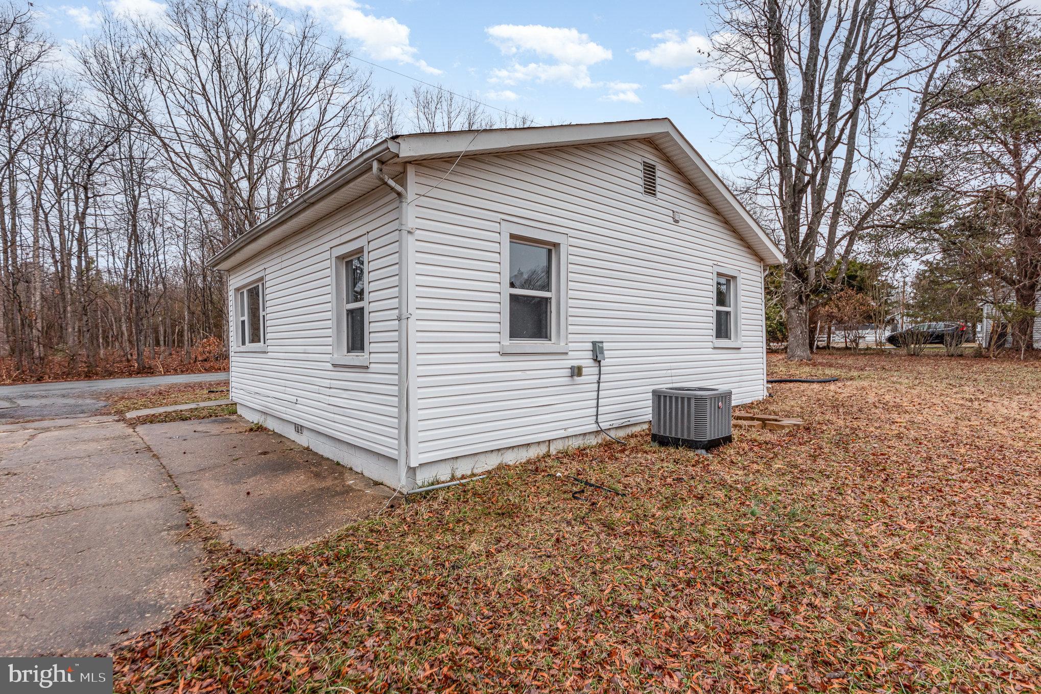 9003 Smiths Bend Road Fredericksburg, VA 22407 - Photo 19 of 22 a view of a house with a yard