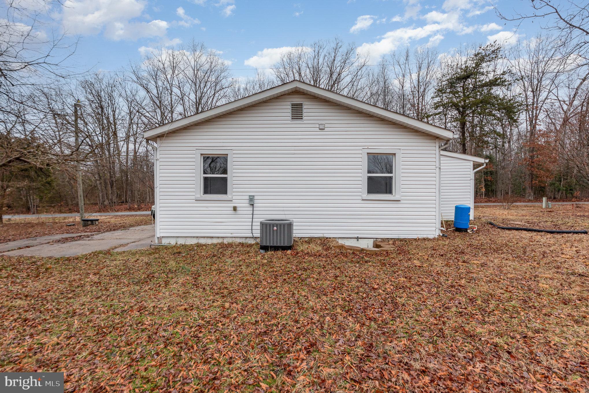 9003 Smiths Bend Road Fredericksburg, VA 22407 - Photo 20 of 22 a view of a house with a yard