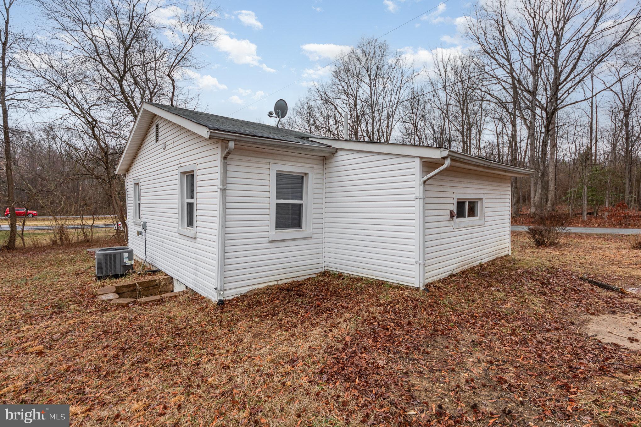 9003 Smiths Bend Road Fredericksburg, VA 22407 - Photo 21 of 22 a view of a house with a yard