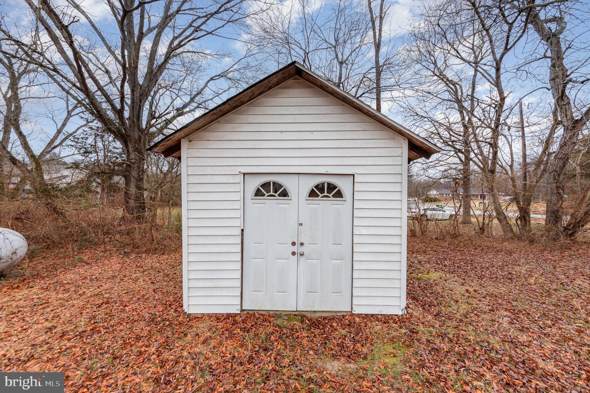 9003 Smiths Bend Road Fredericksburg, VA 22407 - Photo 22 of 22 a view of a house with a yard